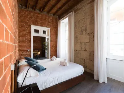 Cama o camas de una habitación en Historical Urban House in Triana Private Chill-out